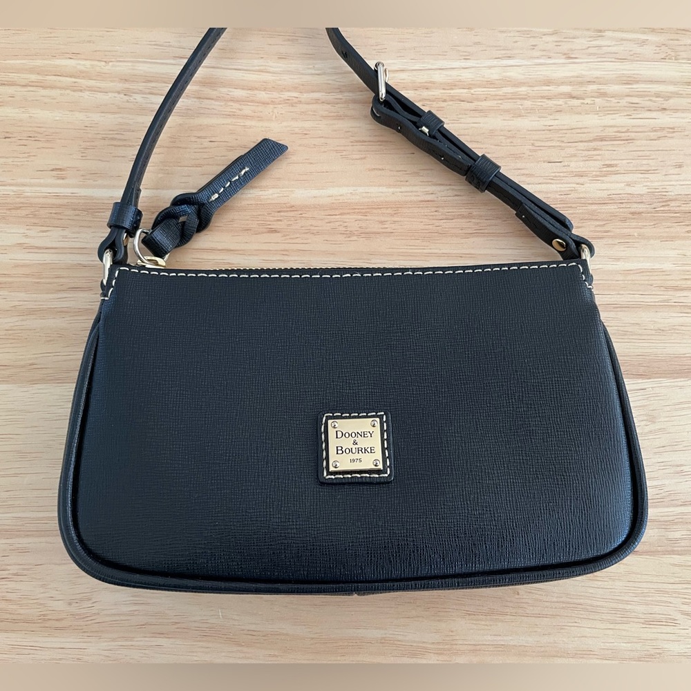 Dooney & Bourke leather crossbody. Color: Black